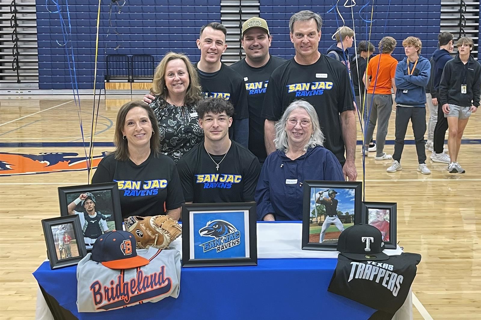 Bridgeland High School senior Lane Vicknair, seated center, poses with his family after signing his letter of intent.